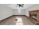 Spacious living room featuring a brick fireplace and wood-look flooring at 202 Berkshire Dr., Myrtle Beach, SC 29588