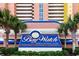Bay Watch Resort & Conference Center sign surrounded by palm trees and lush landscaping at 2711 S Ocean Blvd. # 621, North Myrtle Beach, SC 29582