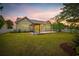 A spacious backyard with a wooden deck, pergola, and lush green grass perfect for outdoor living at 293 Hillsborough Dr., Conway, SC 29526