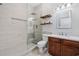 Contemporary bathroom with glass shower and rustic wood shelving at 293 Hillsborough Dr., Conway, SC 29526