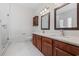 Bathroom with marble countertop, cherry cabinets, and a glass enclosed shower at 293 Hillsborough Dr., Conway, SC 29526