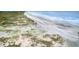 Expansive beach view with dunes and gentle waves, perfect for a relaxing coastal lifestyle at 293 Hillsborough Dr., Conway, SC 29526