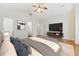 Bright bedroom with vaulted ceilings, ceiling fan, hardwood floors, television and console at 293 Hillsborough Dr., Conway, SC 29526