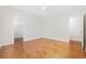 A bedroom with hardwood flooring, white walls, and multiple doorways at 293 Hillsborough Dr., Conway, SC 29526