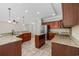 Spacious kitchen features granite countertops, stainless appliances, and a functional center island at 293 Hillsborough Dr., Conway, SC 29526
