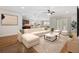 Open-concept living area features a modern aesthetic, hardwood floors and a comfy sofa at 293 Hillsborough Dr., Conway, SC 29526