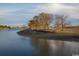 Picturesque waterfront scene with calm water and mature trees, ideal for nature lovers at 293 Hillsborough Dr., Conway, SC 29526