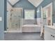 Elegant bathroom featuring a glass shower and separate soaking tub for ultimate relaxation at 3300 Prioloe Dr., Myrtle Beach, SC 29588