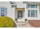 Inviting front entrance with decorative door, sidelights, and manicured shrubbery at 3300 Prioloe Dr., Myrtle Beach, SC 29588
