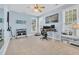 Bright home office featuring modern desk, carpet floors, and a ceiling fan at 3300 Prioloe Dr., Myrtle Beach, SC 29588