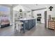 Open kitchen design featuring a center island with seating, stainless appliances, and tile floors at 3300 Prioloe Dr., Myrtle Beach, SC 29588