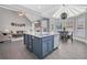 Modern kitchen featuring a large center island, stainless appliances, and an adjacent dining area at 3300 Prioloe Dr., Myrtle Beach, SC 29588