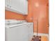 The laundry room has a front-loading washer and dryer with extra storage space at 3300 Prioloe Dr., Myrtle Beach, SC 29588
