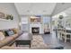 Cozy living room with fireplace, comfortable seating, and plenty of natural light at 3300 Prioloe Dr., Myrtle Beach, SC 29588