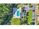 Aerial view of a pool area featuring lounge chairs, tables, and a well-maintained landscape at 3300 Prioloe Dr., Myrtle Beach, SC 29588