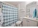 Clean bathroom with a shower-tub combination, a single sink and modern shelving at 351 Logan St., Little River, SC 29566