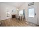 Bright dining room features wood floors, table with seating for six, and coastal decor at 351 Logan St., Little River, SC 29566