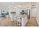 Spacious kitchen with an island, stainless steel appliances, granite countertops, and breakfast bar at 351 Logan St., Little River, SC 29566