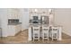 Kitchen island with granite countertops, stainless steel appliances, and three barstools at 351 Logan St., Little River, SC 29566