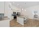 Kitchen with stainless steel appliances, granite countertops, and wood floors at 351 Logan St., Little River, SC 29566