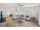 Bright and airy living room featuring hardwood floors, modern decor, and a seamless flow to the dining area at 351 Logan St., Little River, SC 29566
