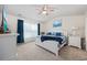 Cozy main bedroom featuring a ceiling fan, white furniture and light-colored carpet at 351 Logan St., Little River, SC 29566