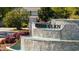 The Heather Glen entrance features a cascading waterfall and stone architecture for a grand sense of arrival at 351 Logan St., Little River, SC 29566