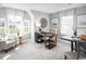 Bright home office with a large desk, comfortable seating, and plenty of natural light at 439 Myrtle Meadows Dr, Conway, SC 29526
