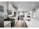 Modern kitchen featuring white cabinets, stainless steel appliances, and a large island at 439 Myrtle Meadows Dr, Conway, SC 29526