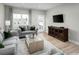 Cozy living room with a plush sofa, stylish decor, and ample natural light at 439 Myrtle Meadows Dr, Conway, SC 29526