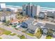 Aerial view of a multi-story condo complex with beach access and ample parking at 4504 S Ocean Blvd. # A, North Myrtle Beach, SC 29582