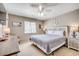 Cozy bedroom featuring a ceiling fan, a queen bed, and nautical-themed decor at 4504 S Ocean Blvd. # A, North Myrtle Beach, SC 29582