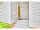 Inviting entryway featuring white steps with brick foundation and a light gray door at 4504 S Ocean Blvd. # A, North Myrtle Beach, SC 29582