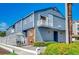 Exterior shot of two-story condo featuring a balcony and well-maintained landscaping at 4504 S Ocean Blvd. # A, North Myrtle Beach, SC 29582
