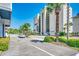 Exterior shot of Beach Club III building with palm trees and parking at 4504 S Ocean Blvd. # A, North Myrtle Beach, SC 29582