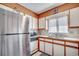 Kitchen with stainless steel refrigerator and appliances and a window above the sink at 4504 S Ocean Blvd. # A, North Myrtle Beach, SC 29582