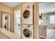 Upstairs laundry area conveniently situated near bedrooms with stacked washer and dryer at 4504 S Ocean Blvd. # A, North Myrtle Beach, SC 29582
