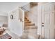 Carpeted staircase with white railings and a neutral color scheme provides access to upper levels at 4504 S Ocean Blvd. # A, North Myrtle Beach, SC 29582