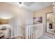 Upstairs landing with staircase and an decorative art and mirror at 4504 S Ocean Blvd. # A, North Myrtle Beach, SC 29582