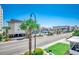 Street view of the exterior highlighting palm trees, street lamps, landscaping, and neighboring buildings at 4504 S Ocean Blvd. # A, North Myrtle Beach, SC 29582