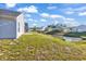 Backyard view shows the grass slope, small waterway and the rear of the home at 500 Dundalk Dr., Conway, SC 29526