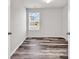 A bright, empty bedroom showcasing a window view and neutral wall paint at 500 Dundalk Dr., Conway, SC 29526