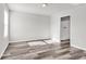 Spacious bedroom with wood-look floors, neutral walls, and ensuite bath at 500 Dundalk Dr., Conway, SC 29526