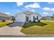 Charming single-story home with a well-manicured lawn and a driveway leading to an attached garage at 500 Dundalk Dr., Conway, SC 29526