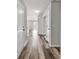 Hallway leading to other areas of the home with light-colored walls and wood-style flooring at 500 Dundalk Dr., Conway, SC 29526