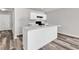 Kitchen island with white cabinets, sink, and marble countertops at 500 Dundalk Dr., Conway, SC 29526