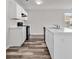 Bright kitchen featuring white cabinets, marble countertops, and an island with bar seating at 500 Dundalk Dr., Conway, SC 29526