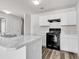 Bright kitchen features white cabinets, modern countertops, and new appliances at 500 Dundalk Dr., Conway, SC 29526