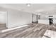 Living room with luxury vinyl flooring and open access to other rooms in the house at 500 Dundalk Dr., Conway, SC 29526