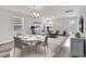 Bright living room and dining area with wood floors, neutral tones and plenty of natural light at 500 Dundalk Dr., Conway, SC 29526